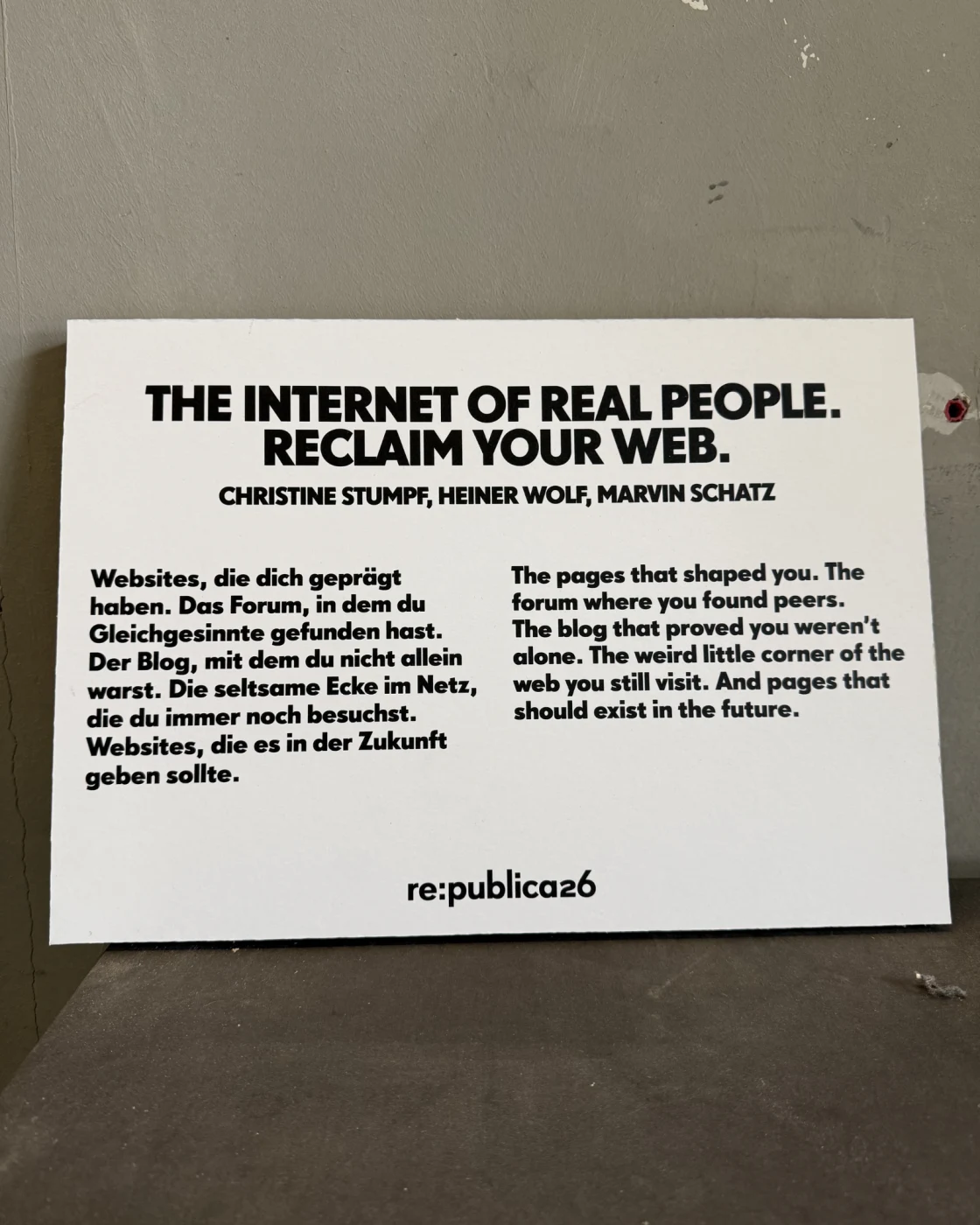 Printed card: 'The Internet of Real People. Reclaim your web.' credited to Christine Stumpf, Heiner Wolf and Marvin Schatz, re:publica 26