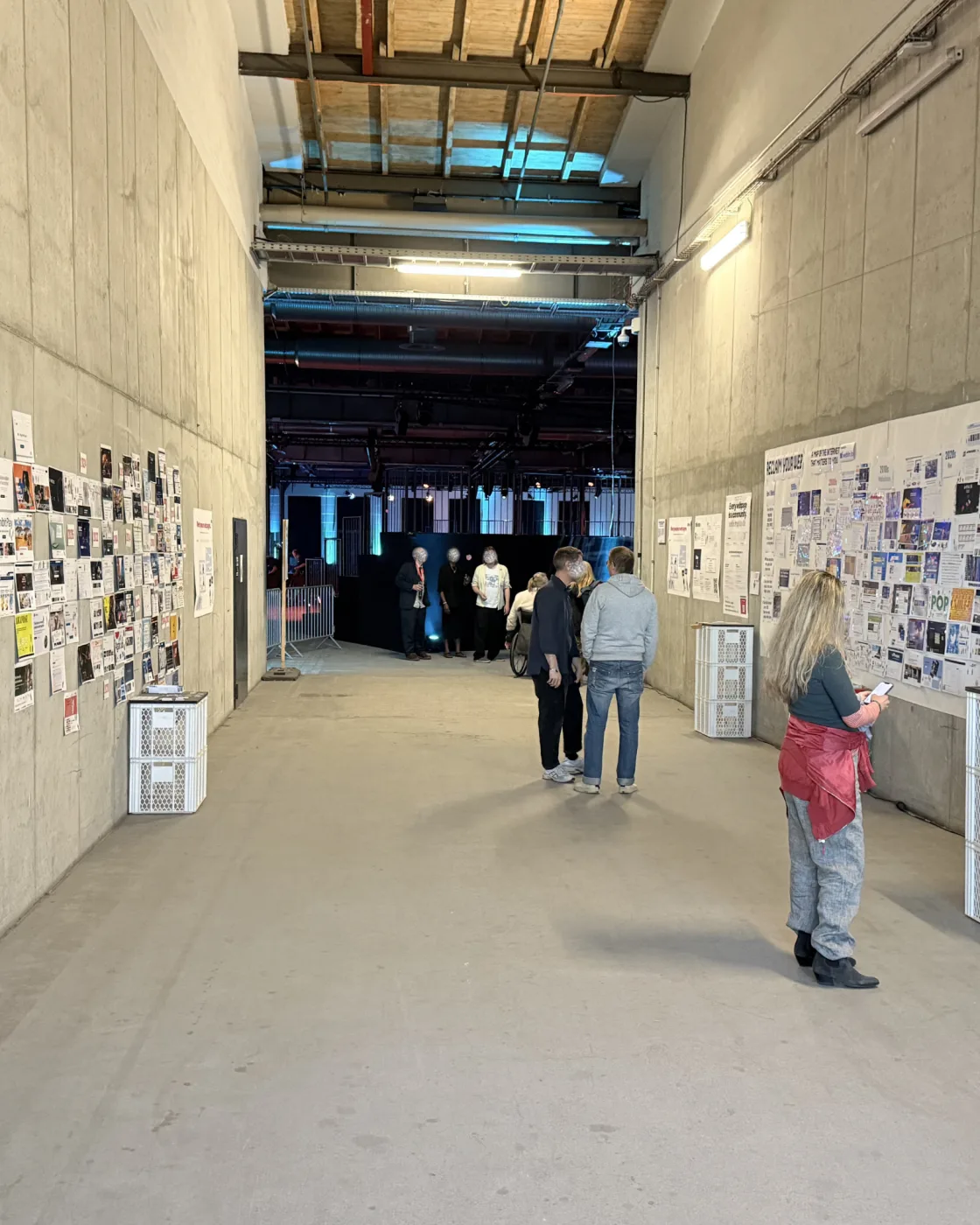 The re:publica venue hall with weblin's printed-web walls on both sides and visitors walking through